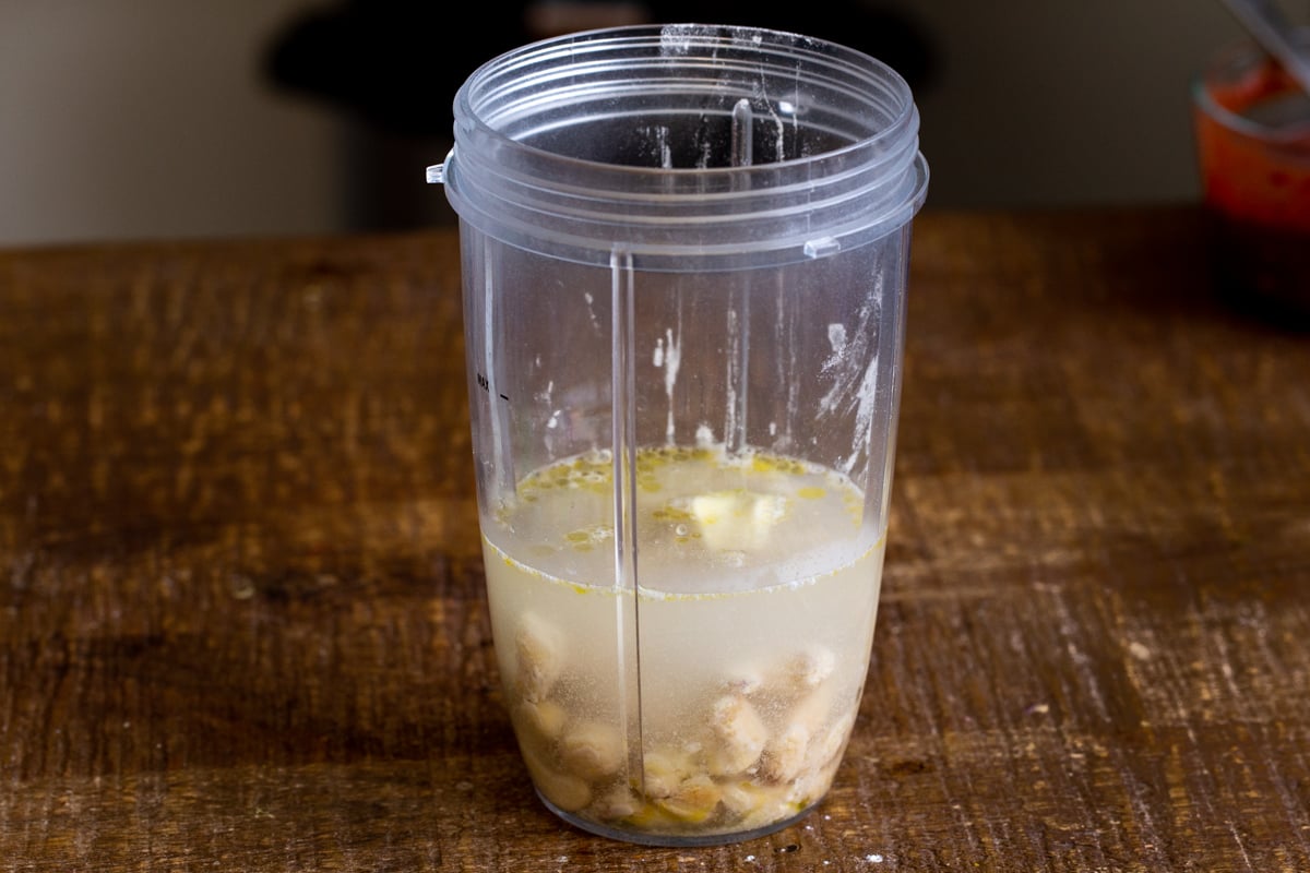 ingredients for vegan mozzarella cheese sauce in a measuring cup
