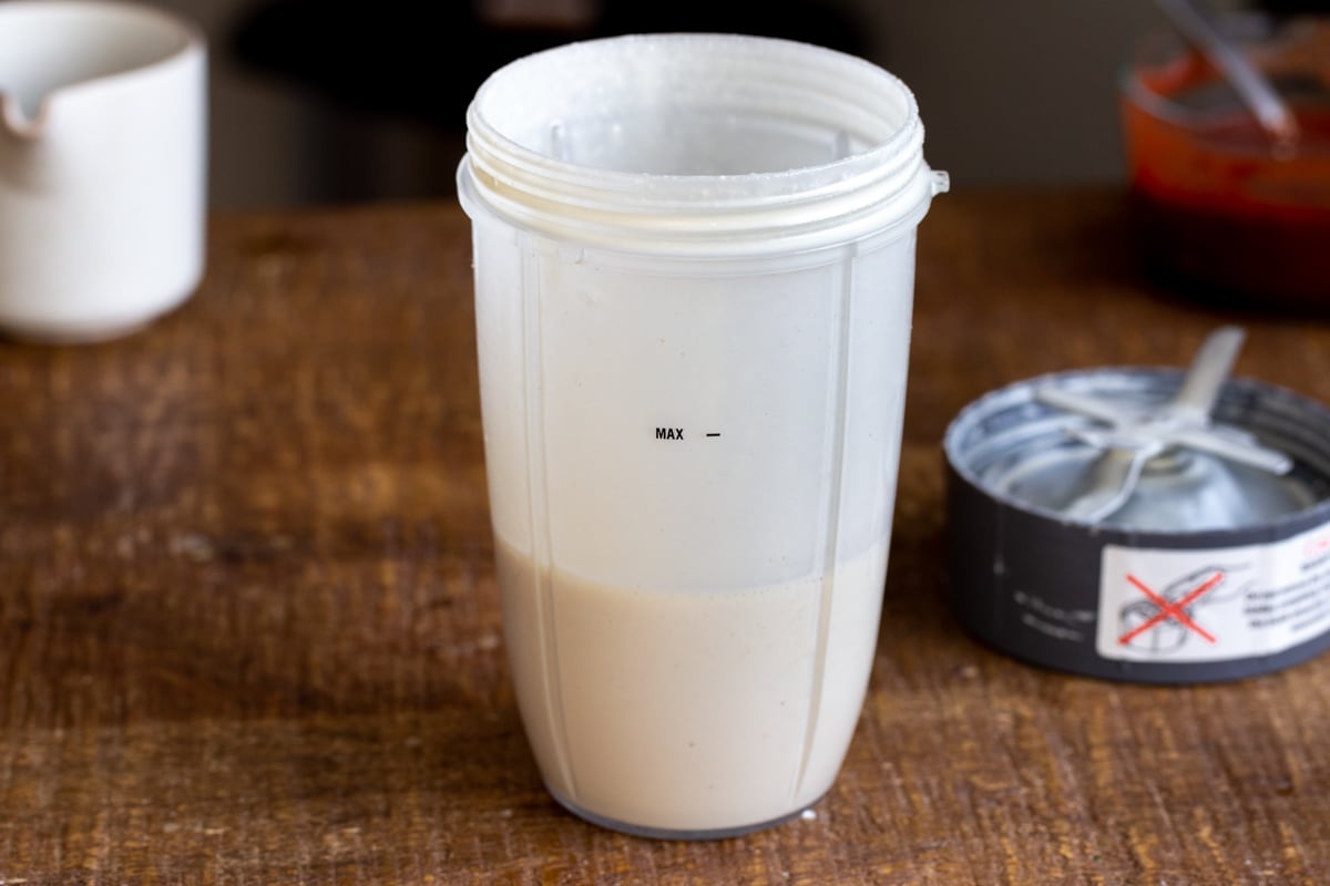 vegan liquid mozzarella in a measuring cup