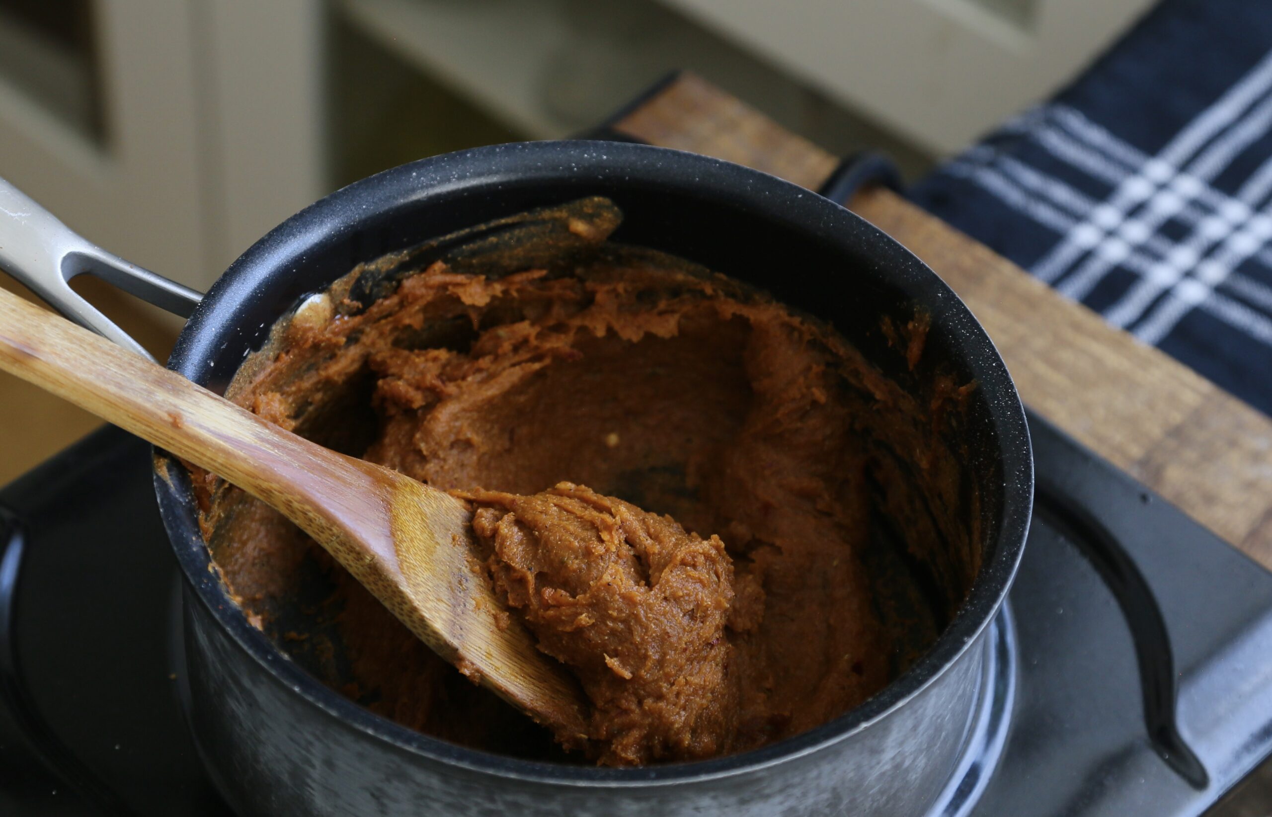 vegan pepperoni mixture in a black saucepan