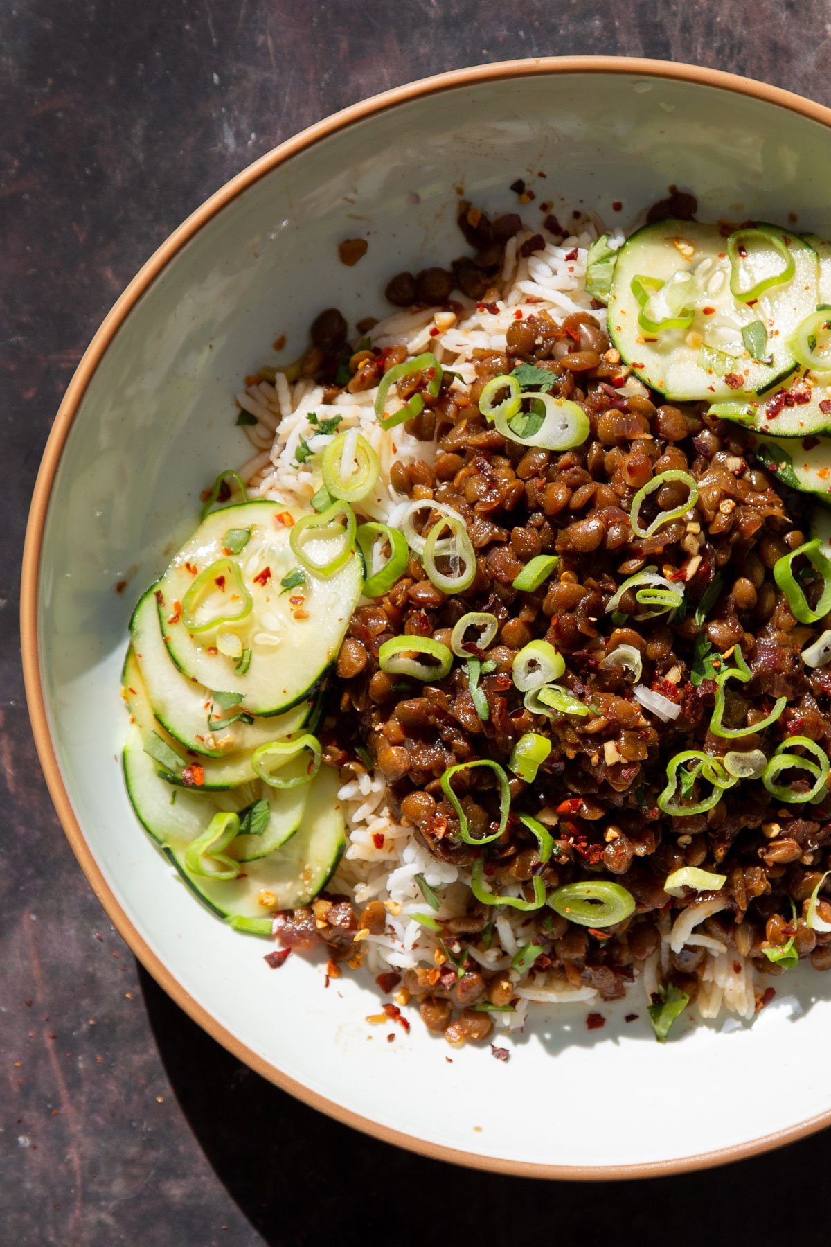 vegan caramelized vietnamese pork lentils served over rice with cucumbers