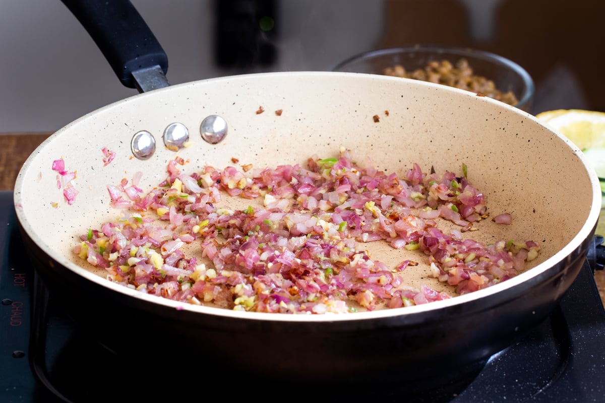 sauteed onion with ginger and chili in a sauteeing pan