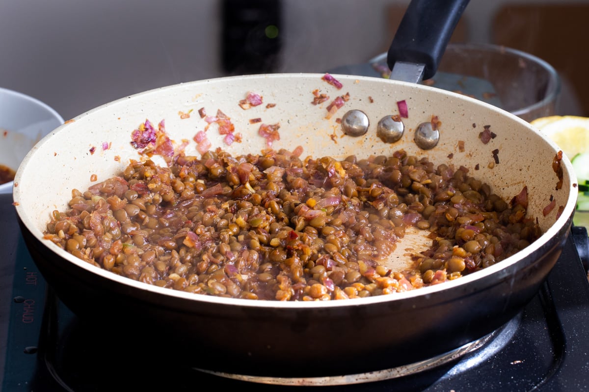 caramelized lentils simmering in a pan