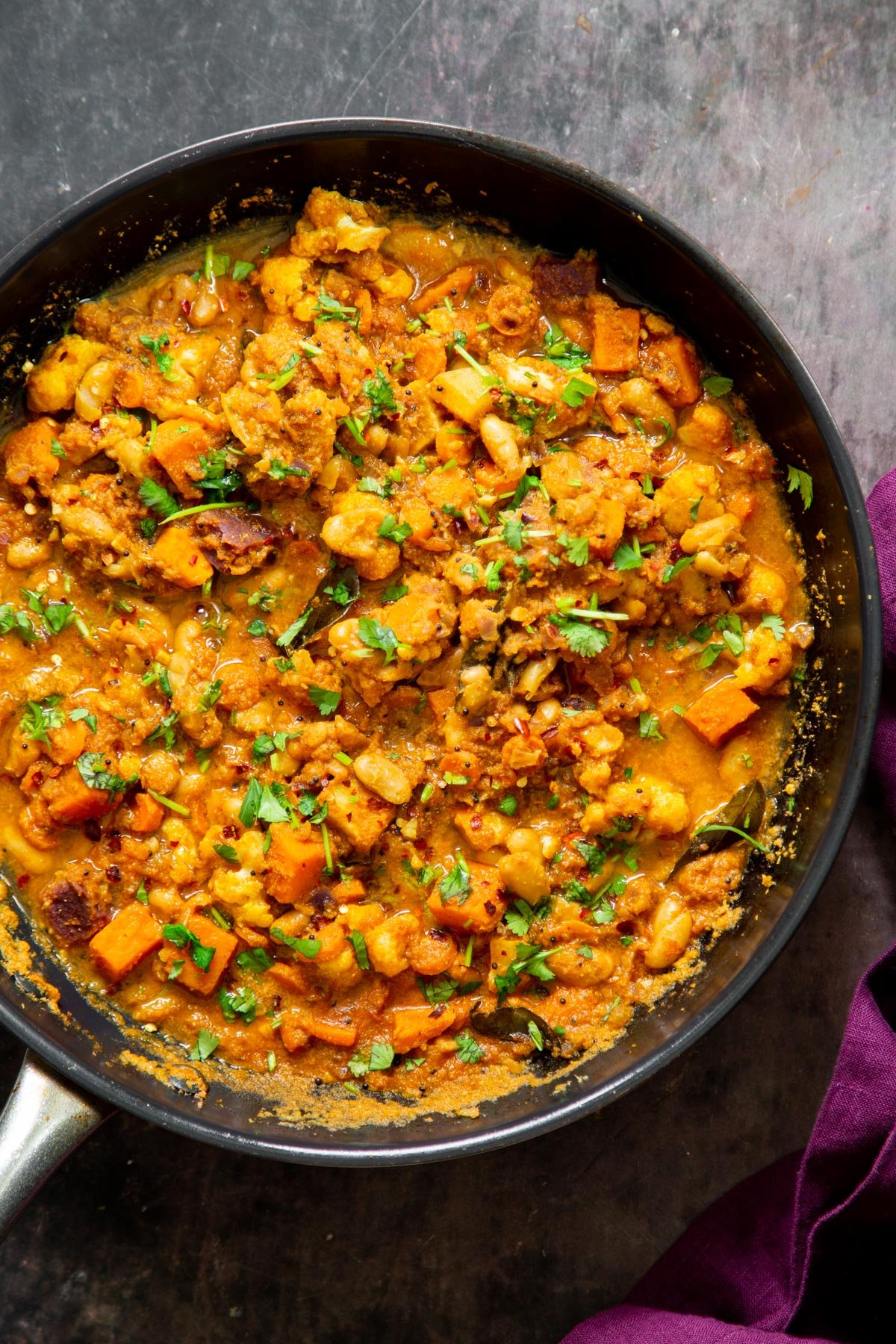vegan Malabar curry with simmered veggies in a sauteeing pan 