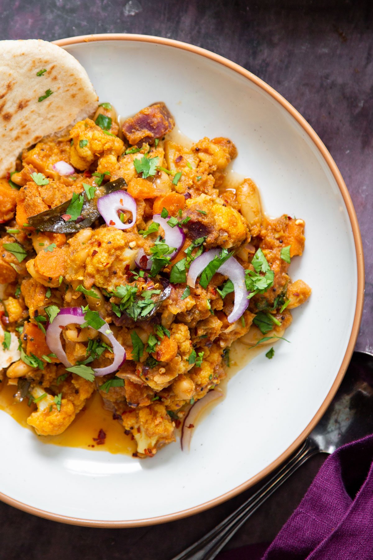 vegan malabar veggie curry served with simmered veggies 
