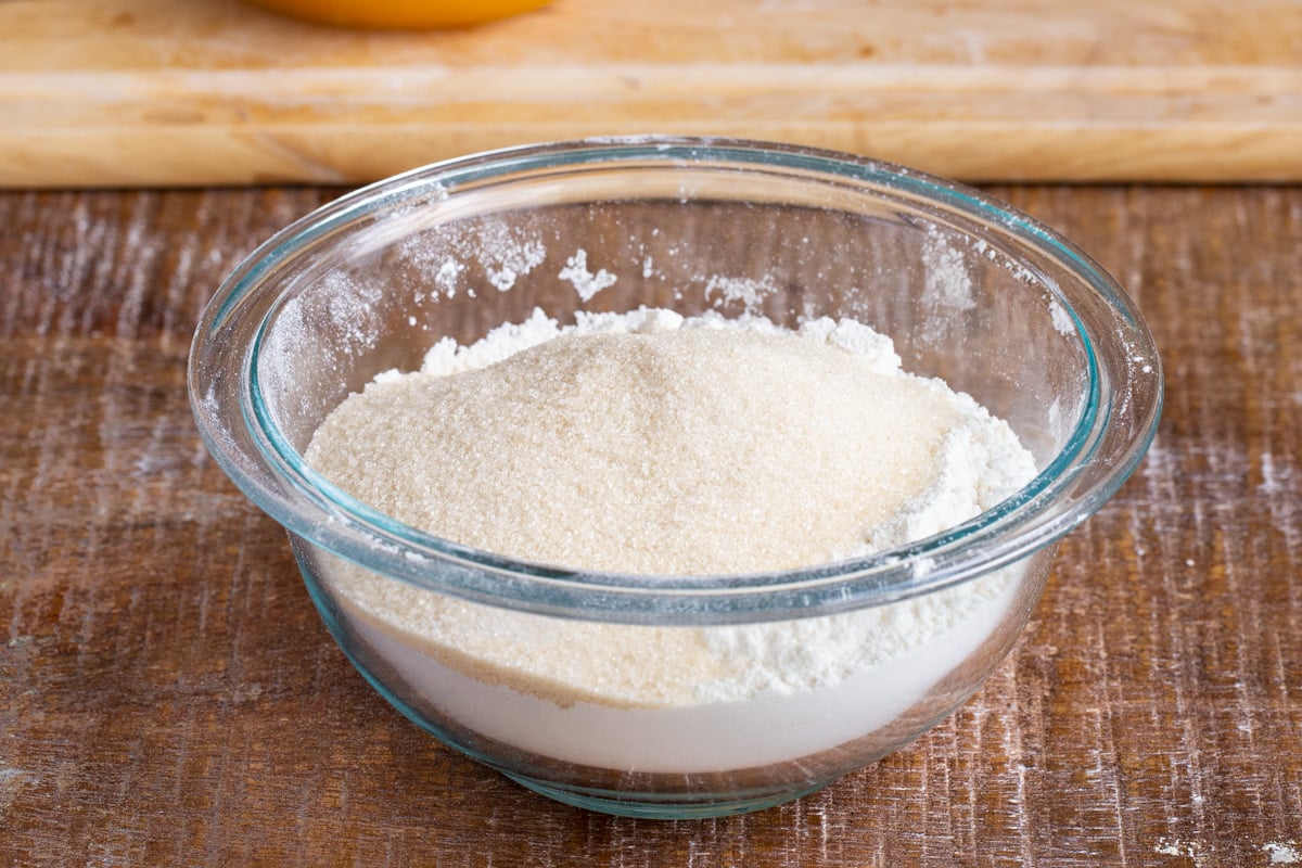 dry ingredients for vegan mango cake in a glass bowl