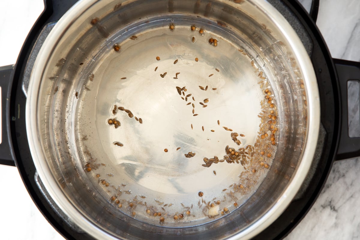 cumin seeds sizzling in an Instant Pot