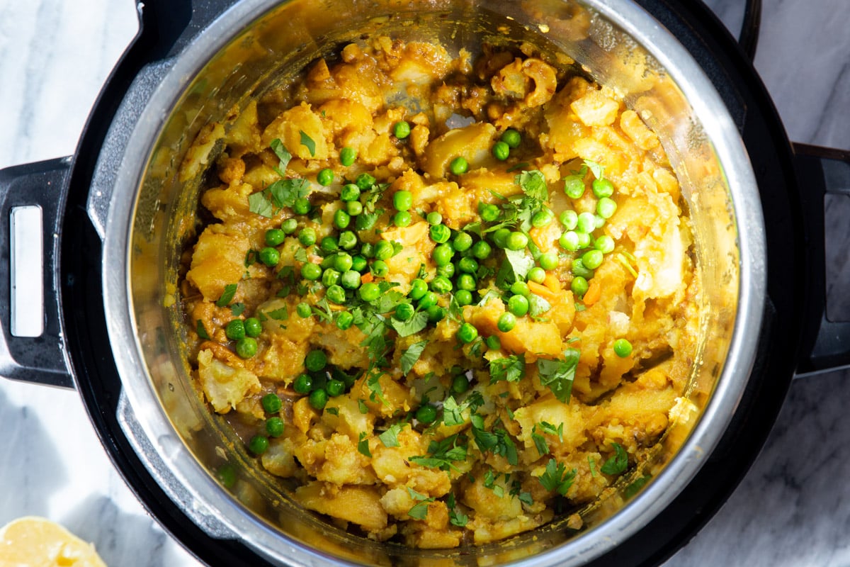 peas and cilantro being added to Instant pot to make pie filling