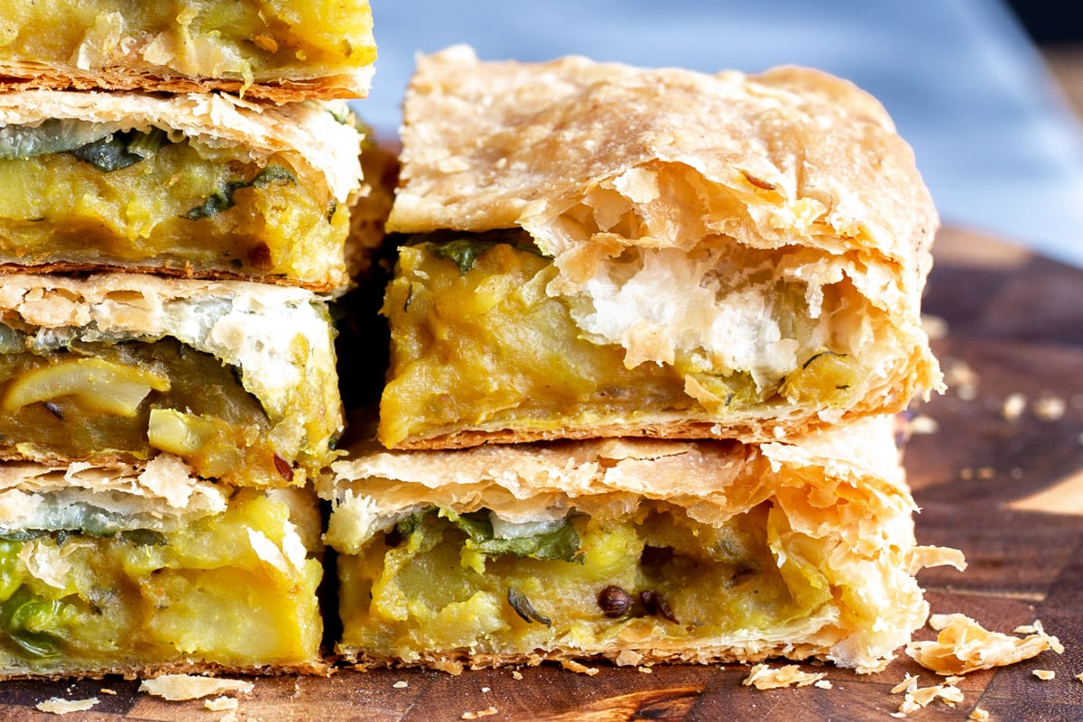 stacked pieces of vegan samosa pie