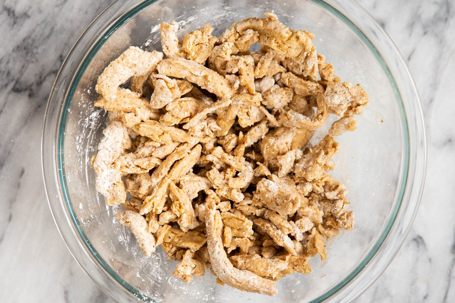 coated soycurl chunks in a glass bowl