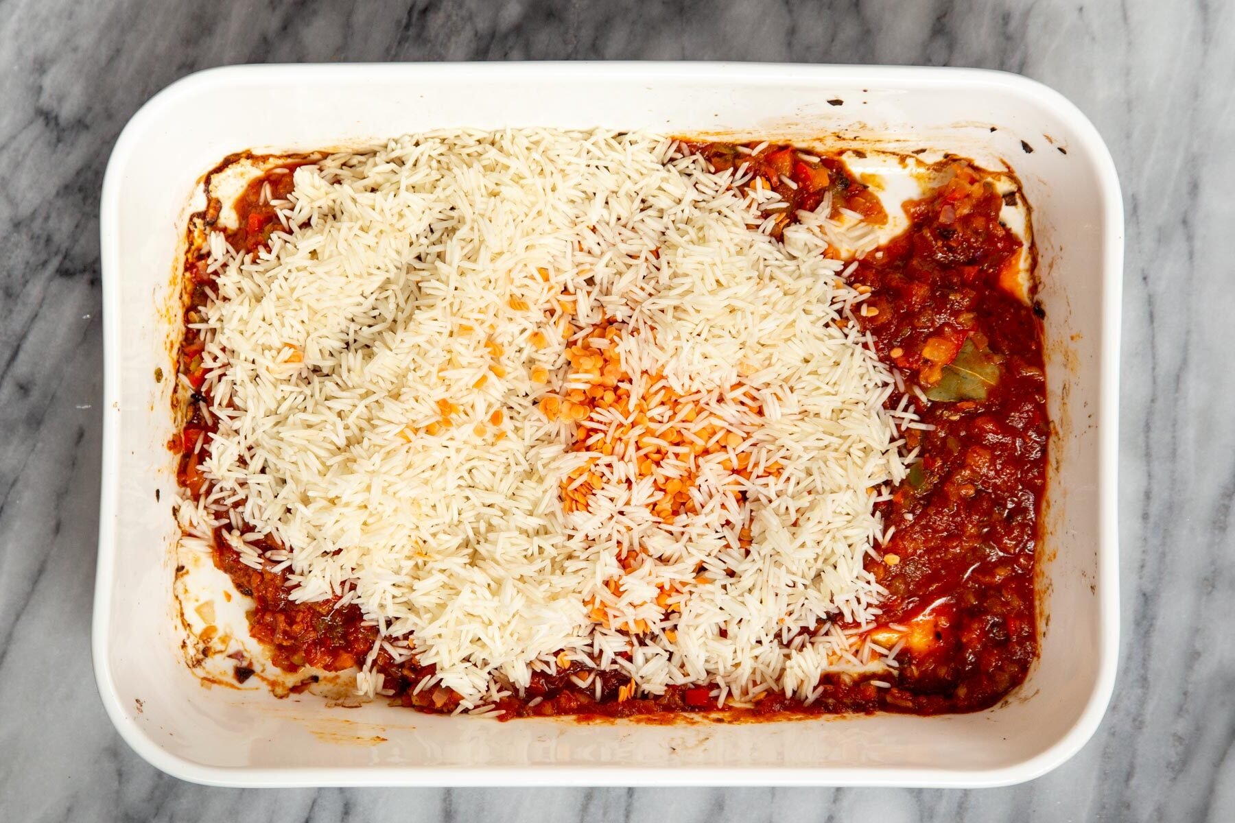 ingredients for Tex Mex rice casserole in a white casserole dish