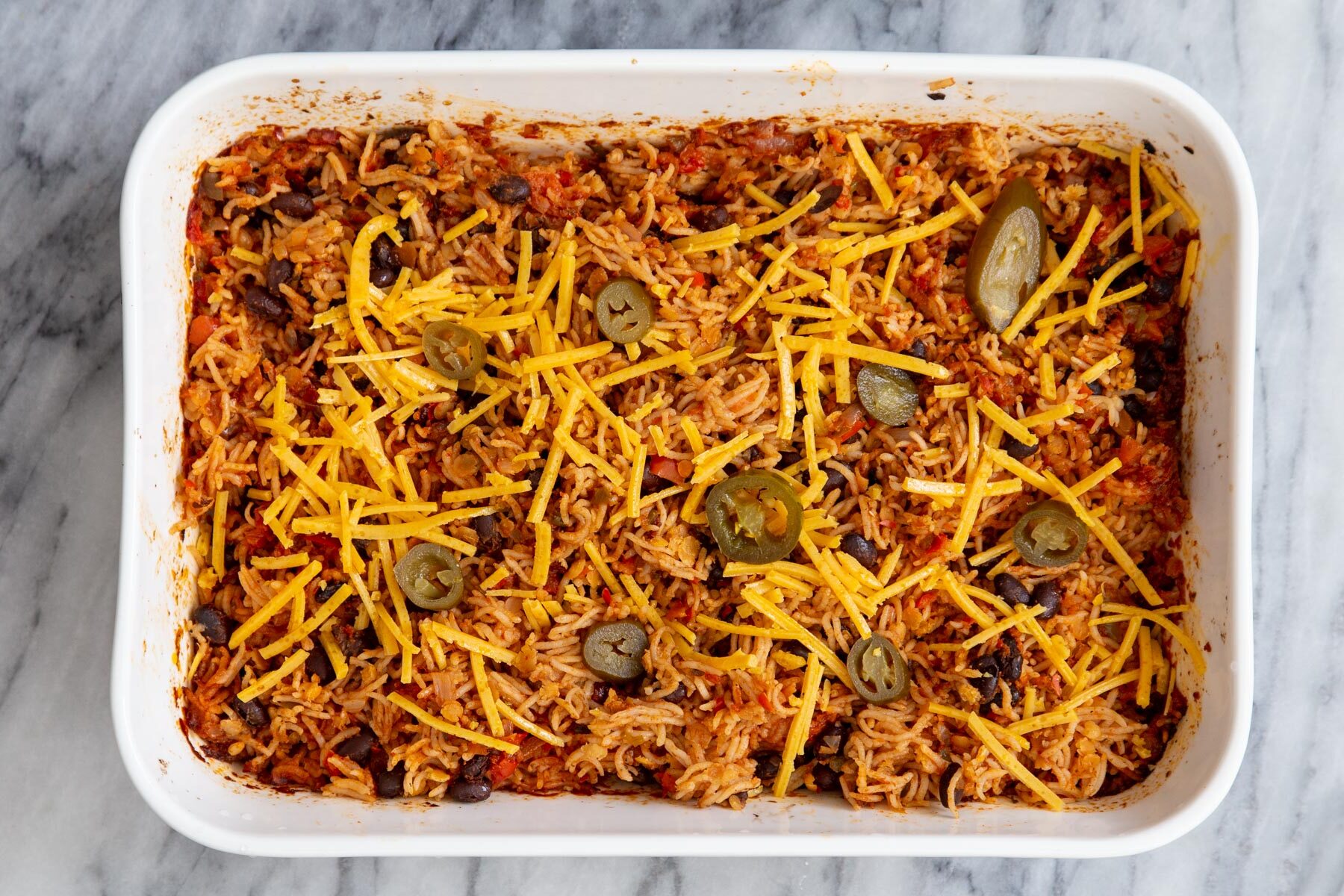 vegan Tex Mex rice casserole with jalapeno and vegan cheese