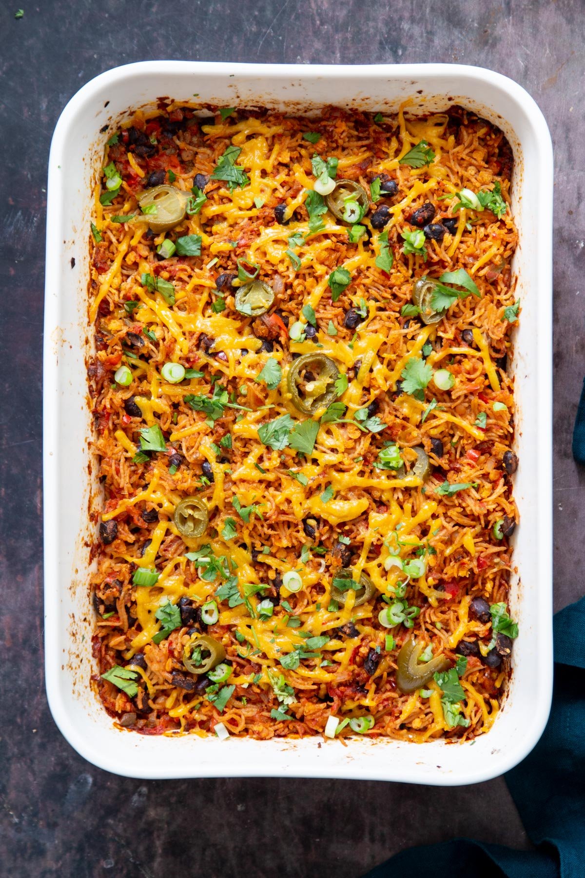 vegan Tex Mex rice casserole sprinkled with cilantro and green onion