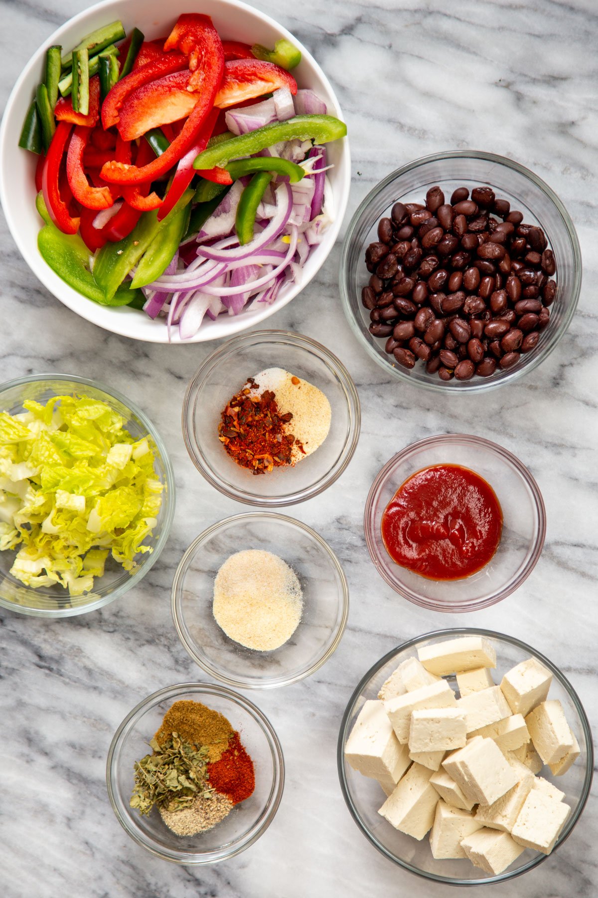 ingredients for tofu tacos on a marble countertop