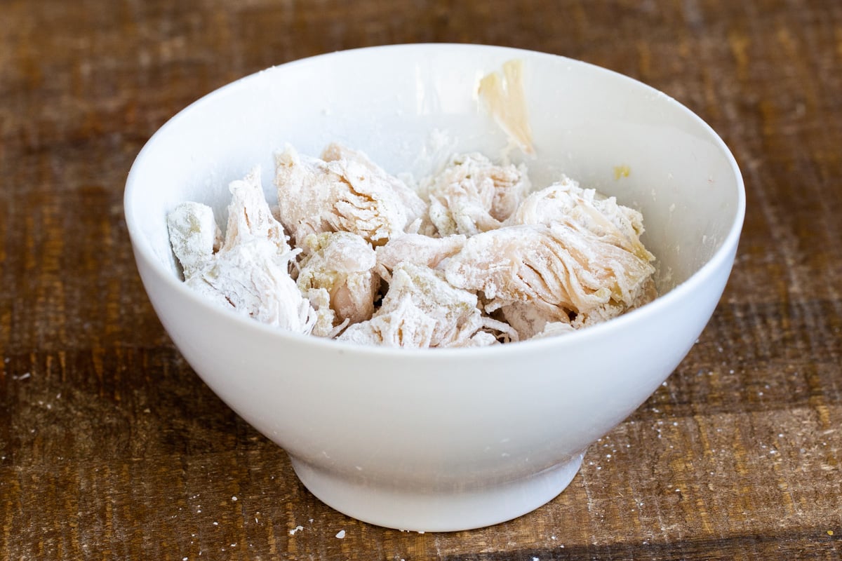 jackfruit tossed with cornstarch in a small white bowl