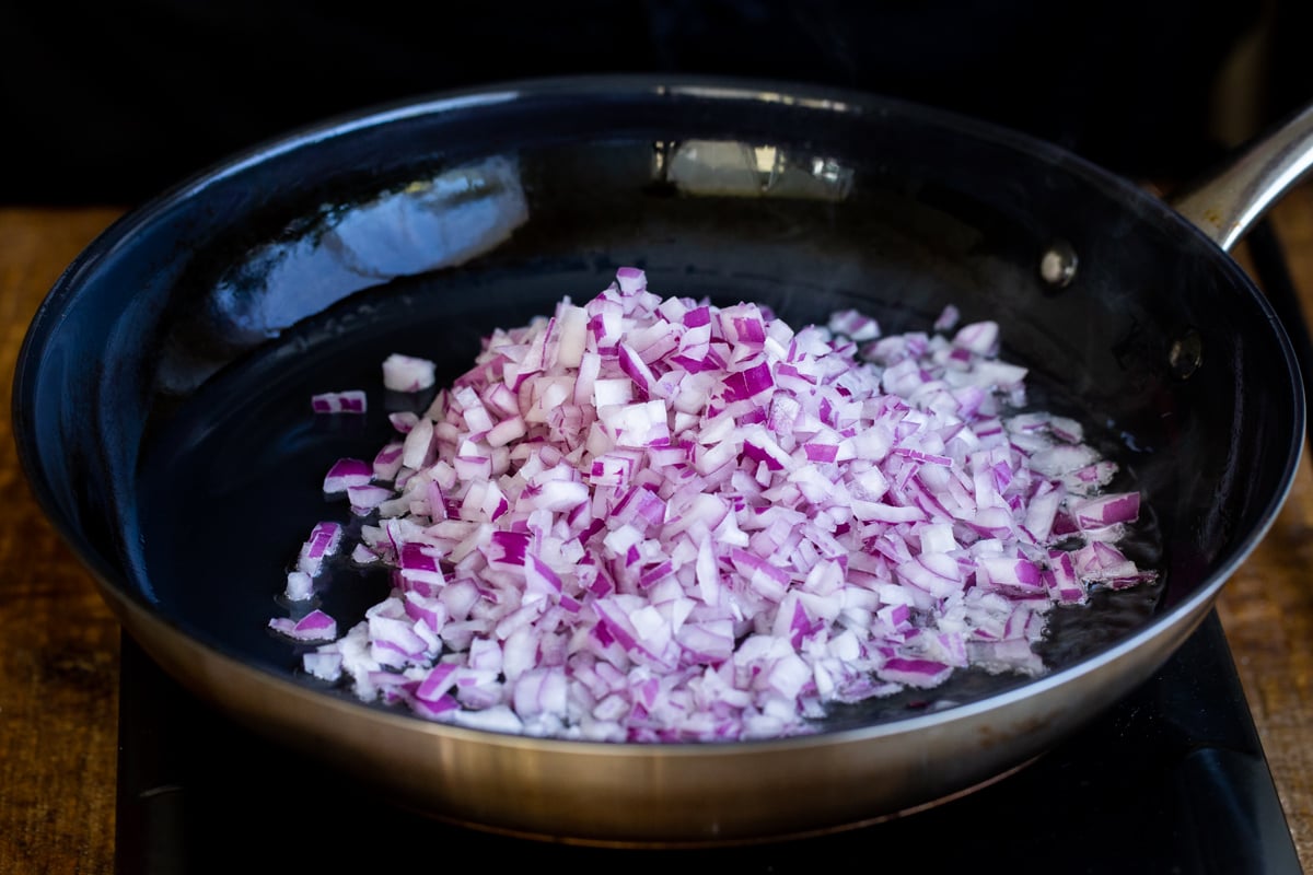 chopped onions in a black skillet