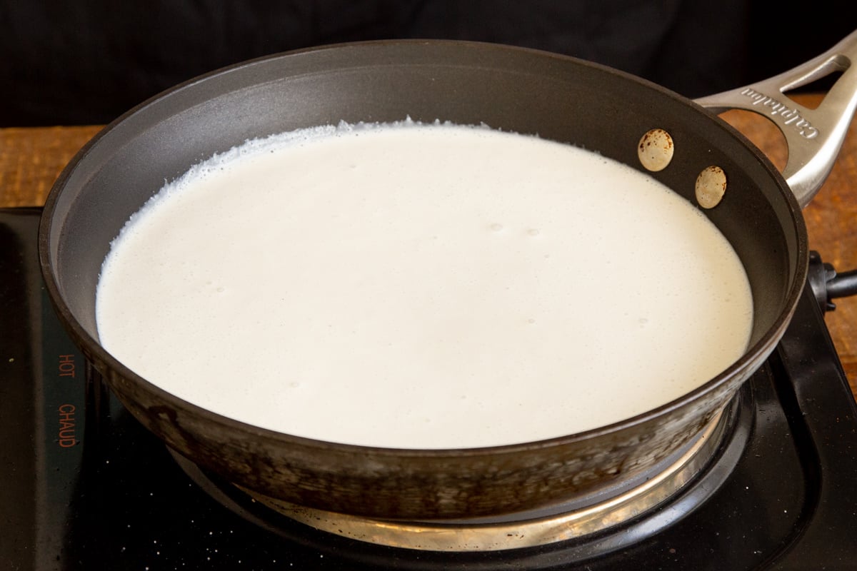 vegan mascarpone cheese being cooked in a saucepan