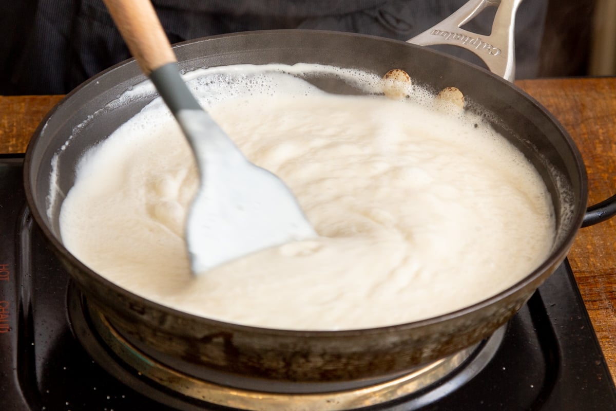 vegan cashew mascarpone cream being reduced in a saucepan
