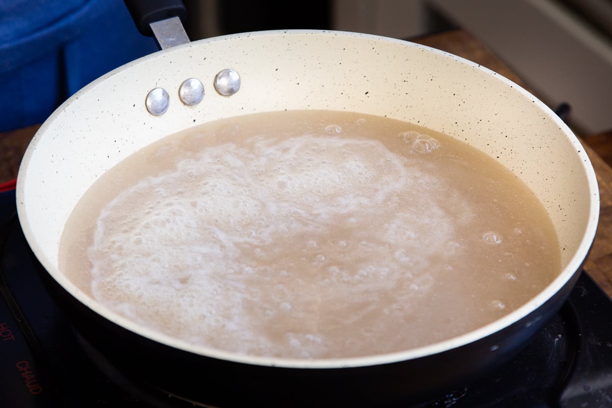 coconut milk and sugar in a sauteeing pan