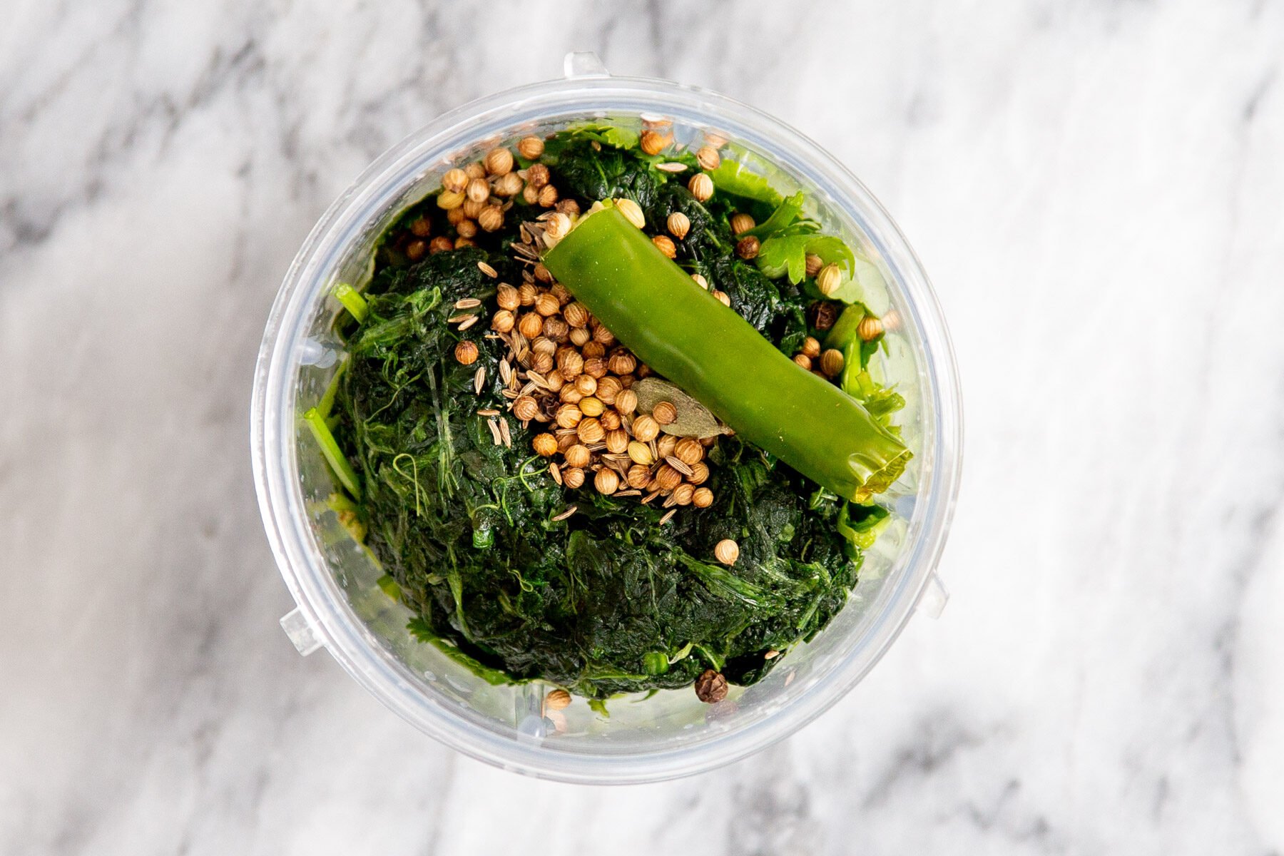 ingredients for green keema sauce in a food processor