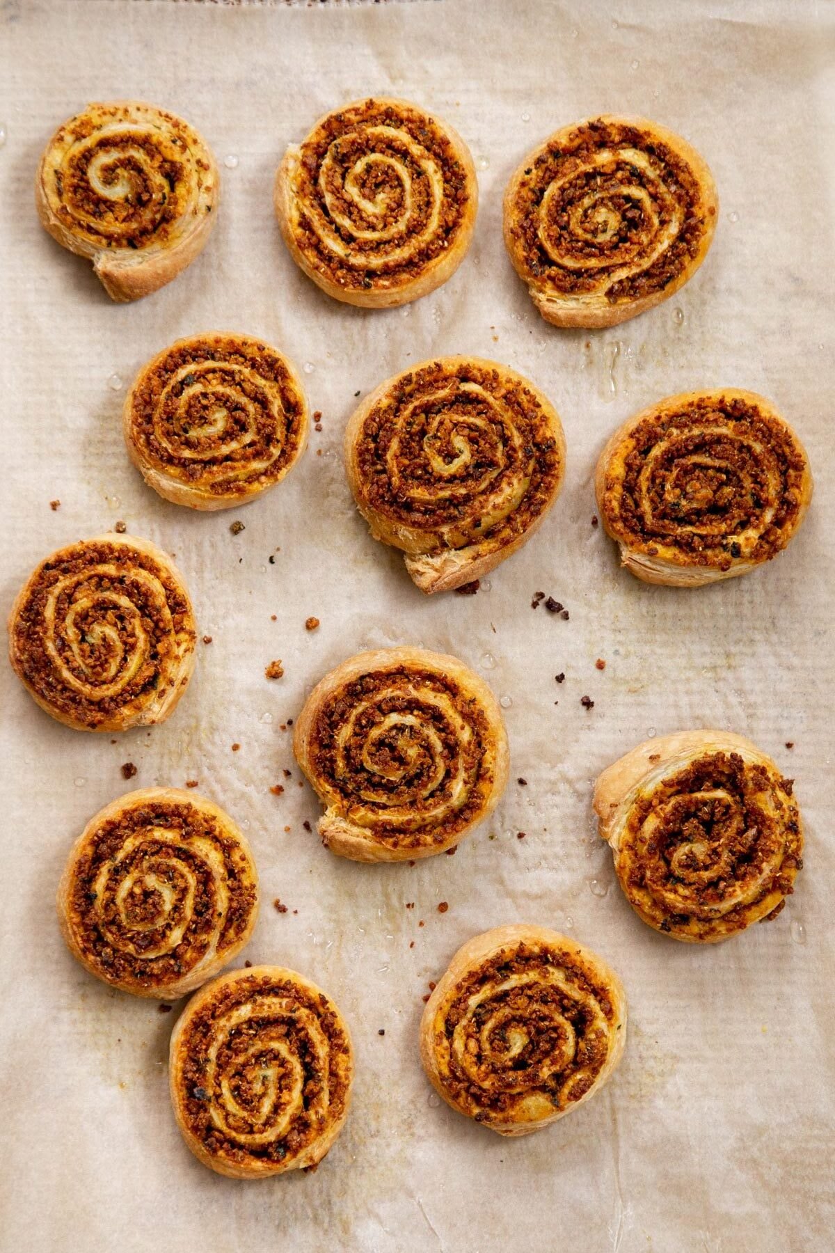 vegan pinwheels on a sheet of parchment paper