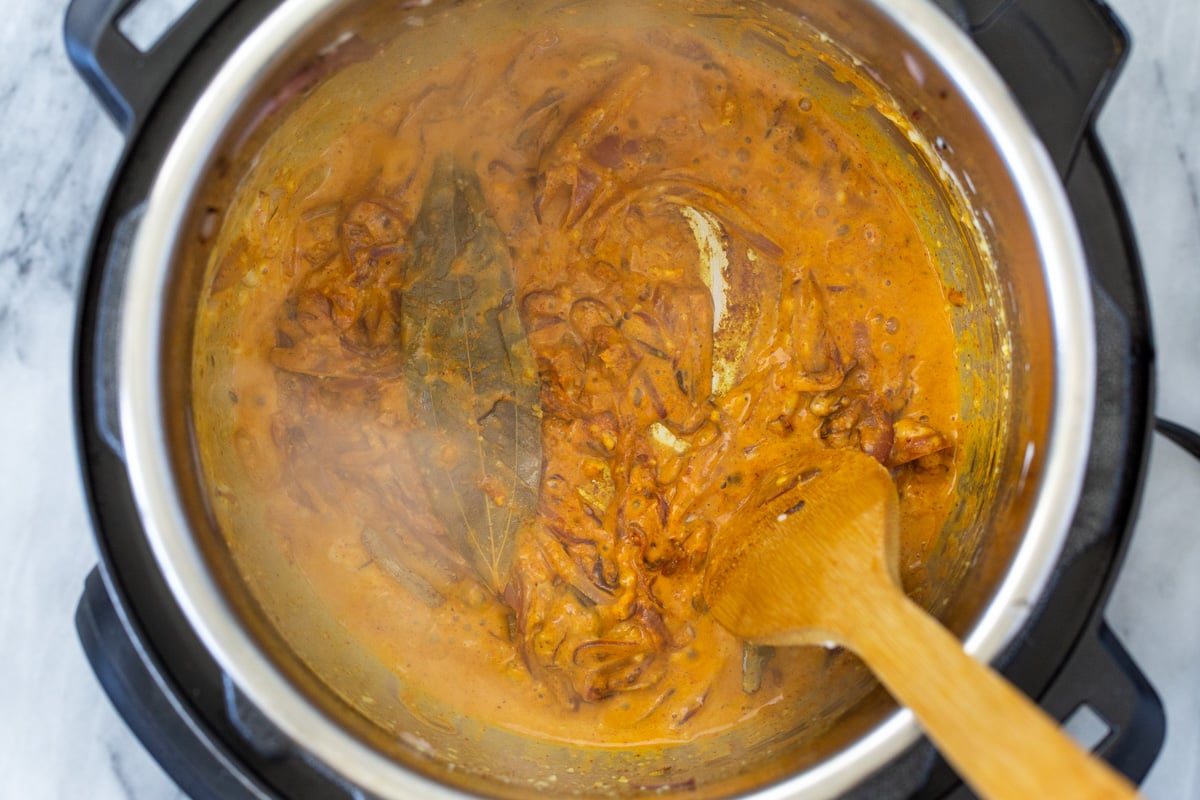 spices, yogurt and onions in an Instant Pot