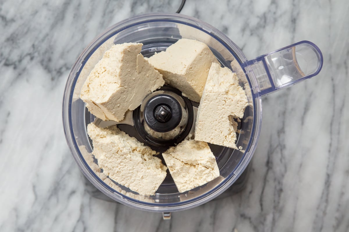 tofu cubes in a food processor container