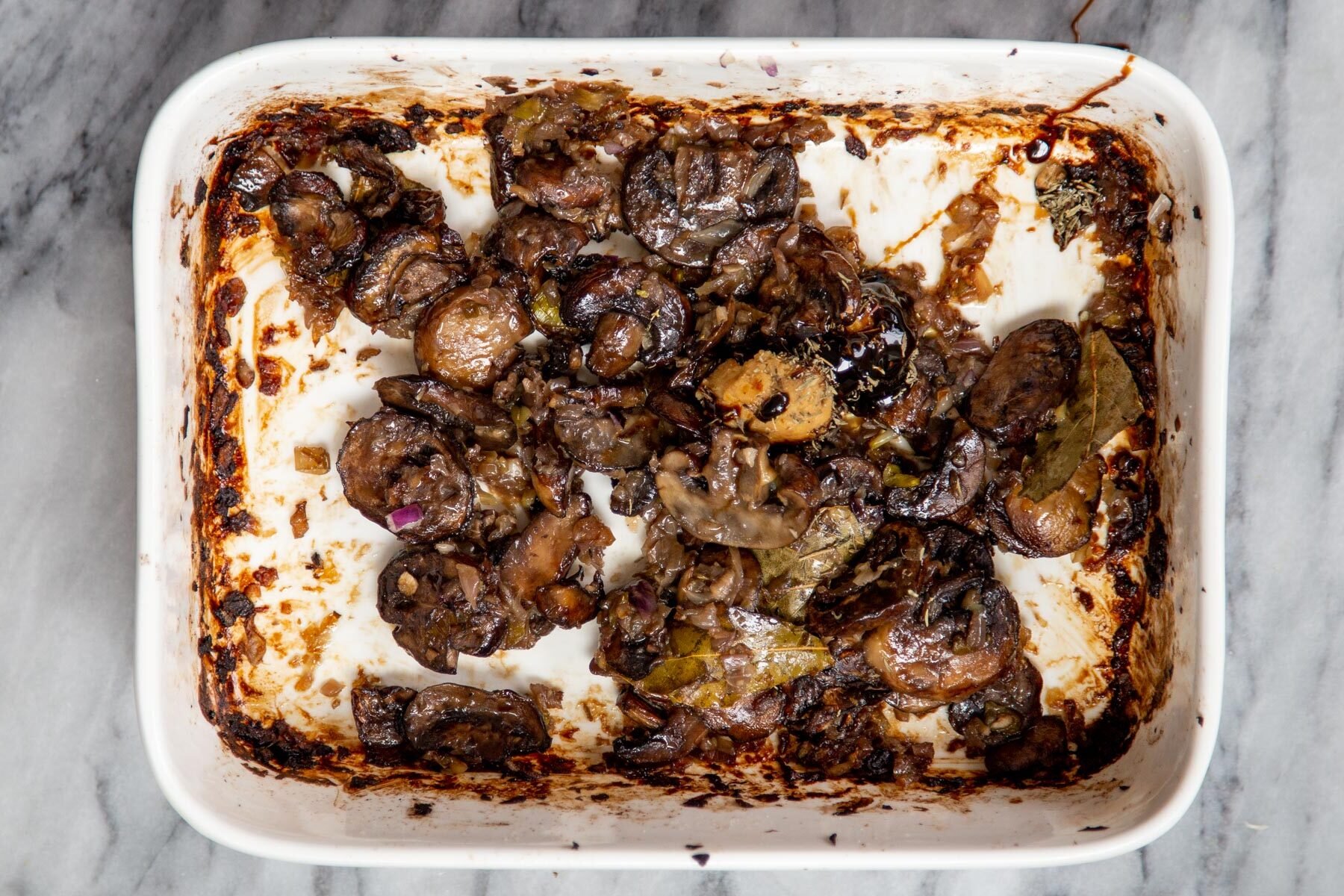caramelized mushrooms in a white casserole dish