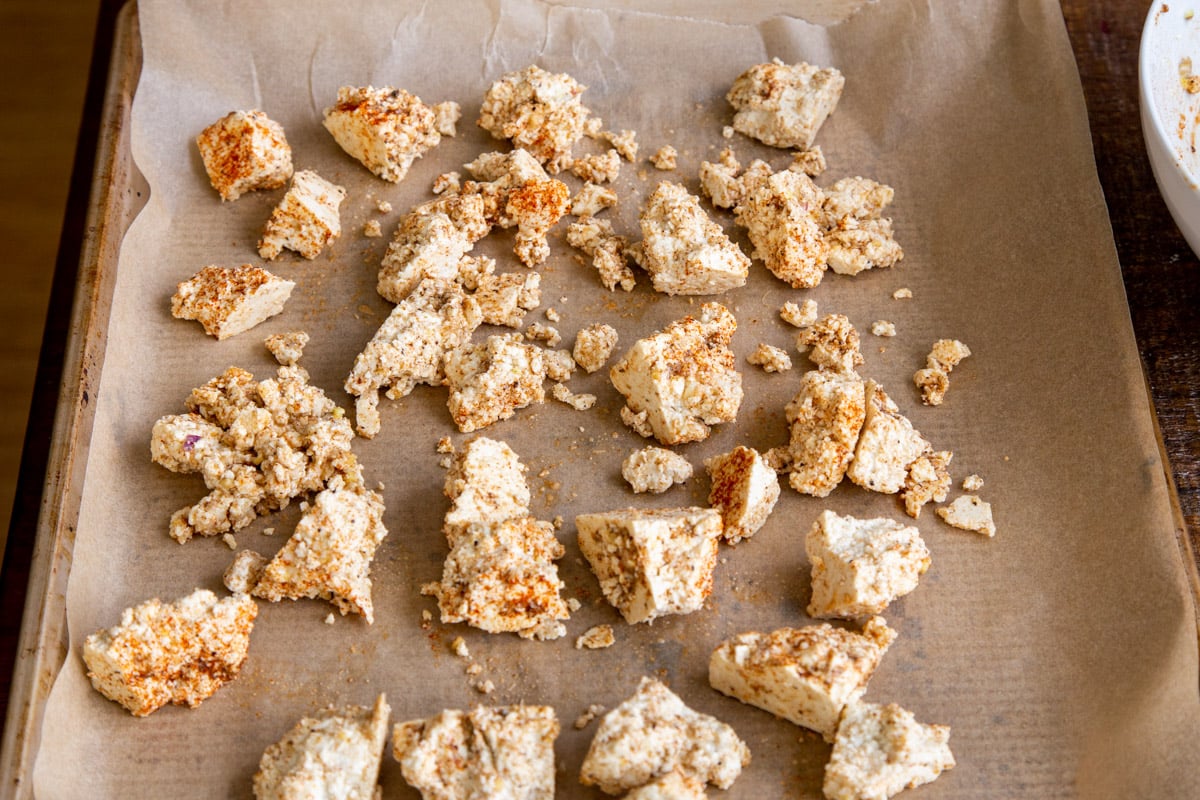 marinated tofu chunks on a baking sheet