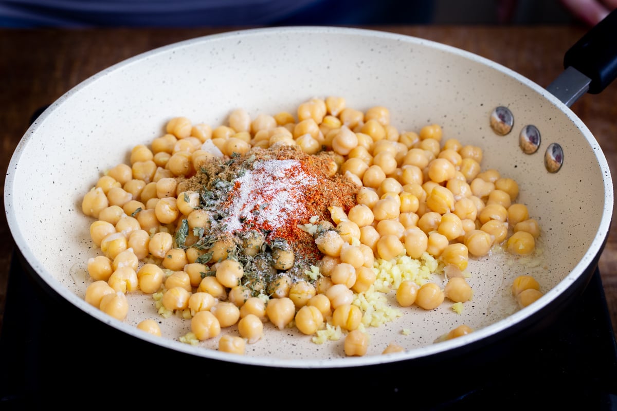 chickpeas in a sauteeing pan with spices