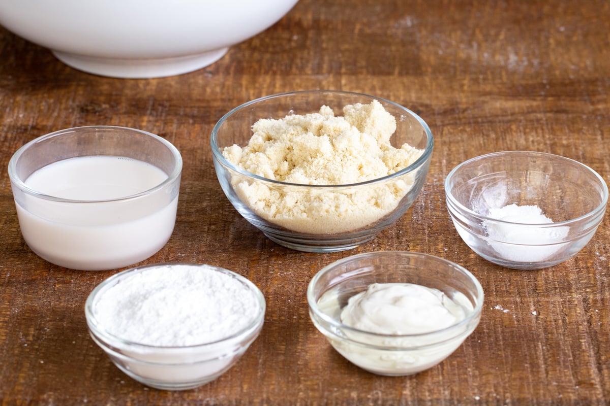 ingredients for vegan almond flour naan bread on a wooden surface