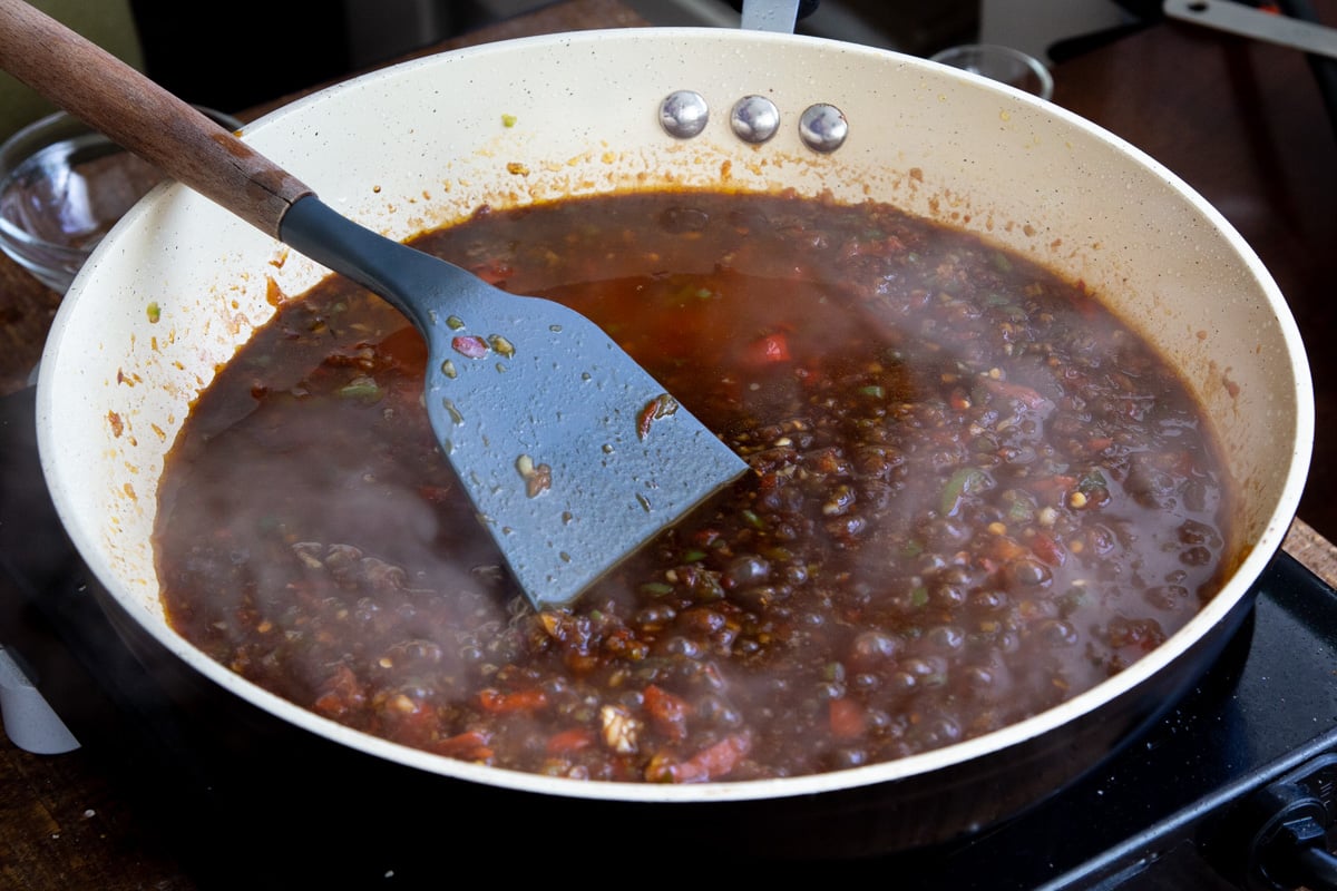 Manchurian sauce simmering in a pan