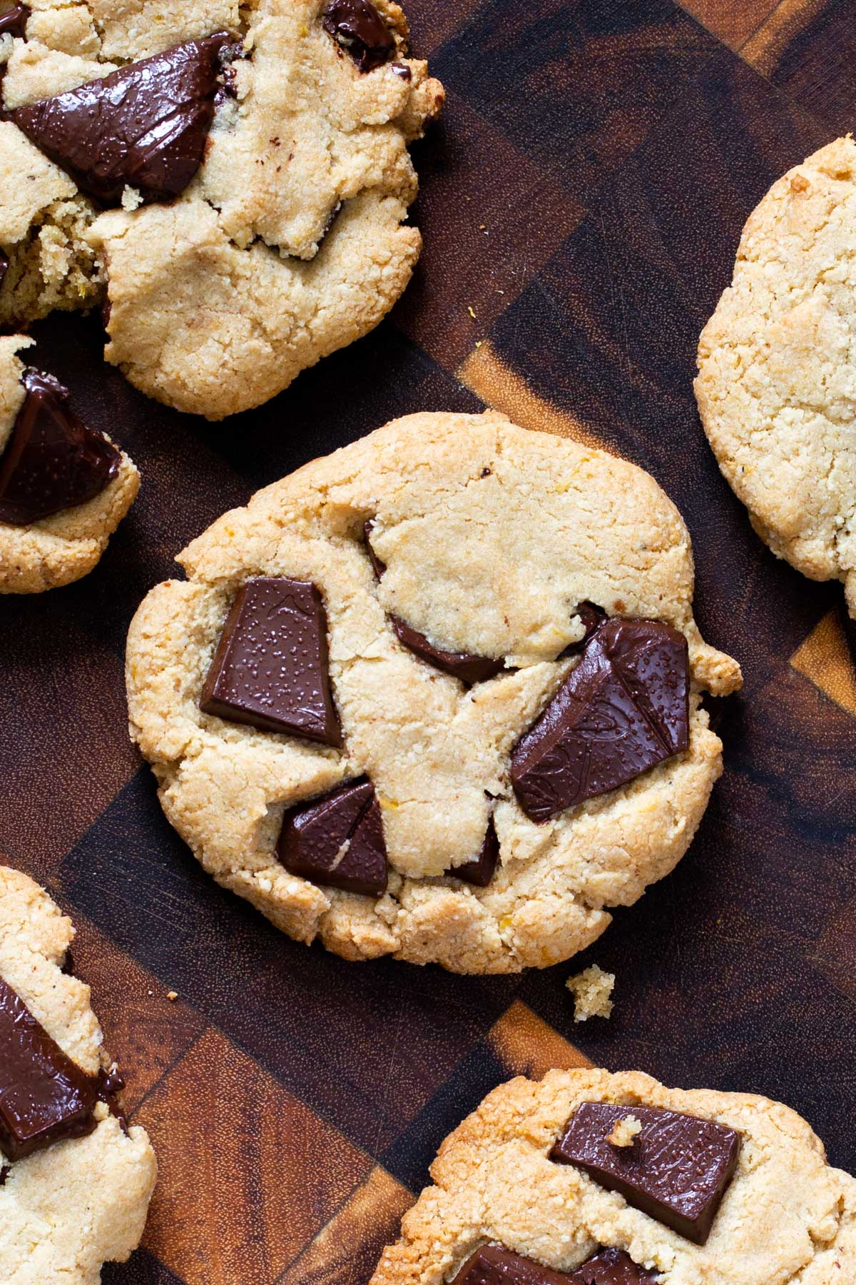 almond flour chocolate chunk cookies on a wooden chopping board