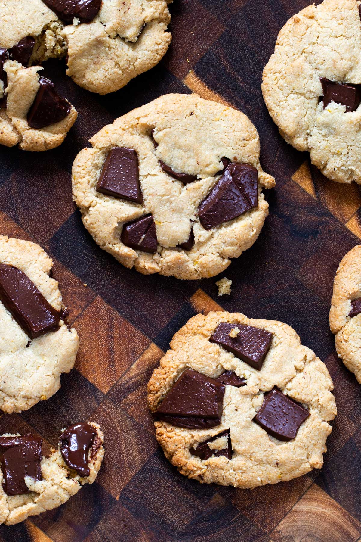 almond flour cookies with chocolate chunks on a wooden chopping board