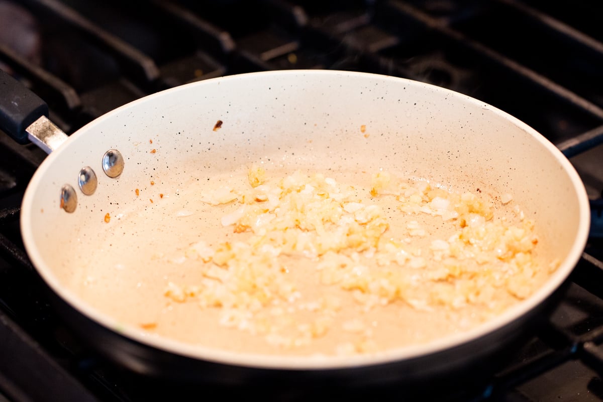 minced onions in a sauteeing pan