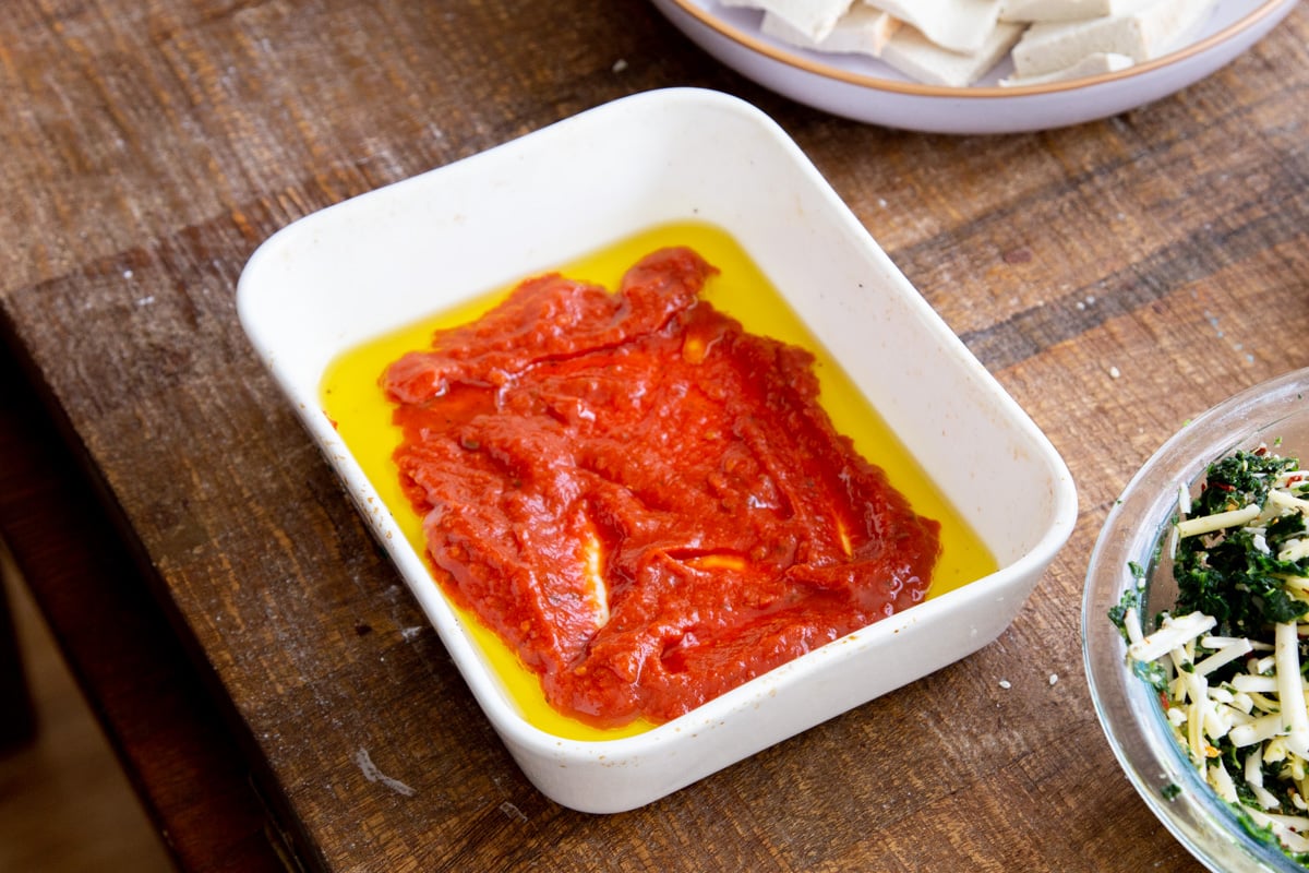 olive oil and marinara sauce in a small casserole dish