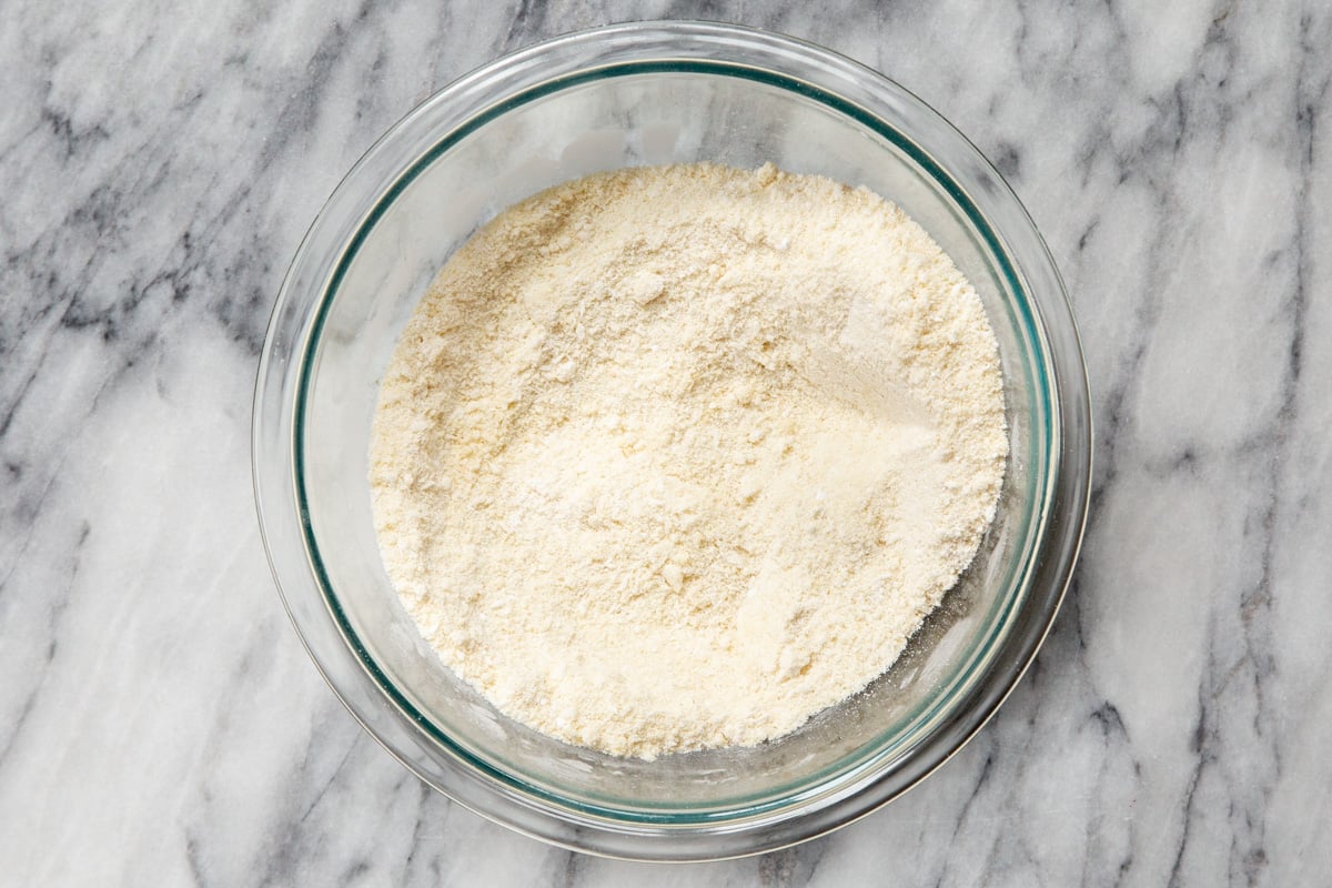 dry ingredients for vegan almond joy cookies in a glass bowl