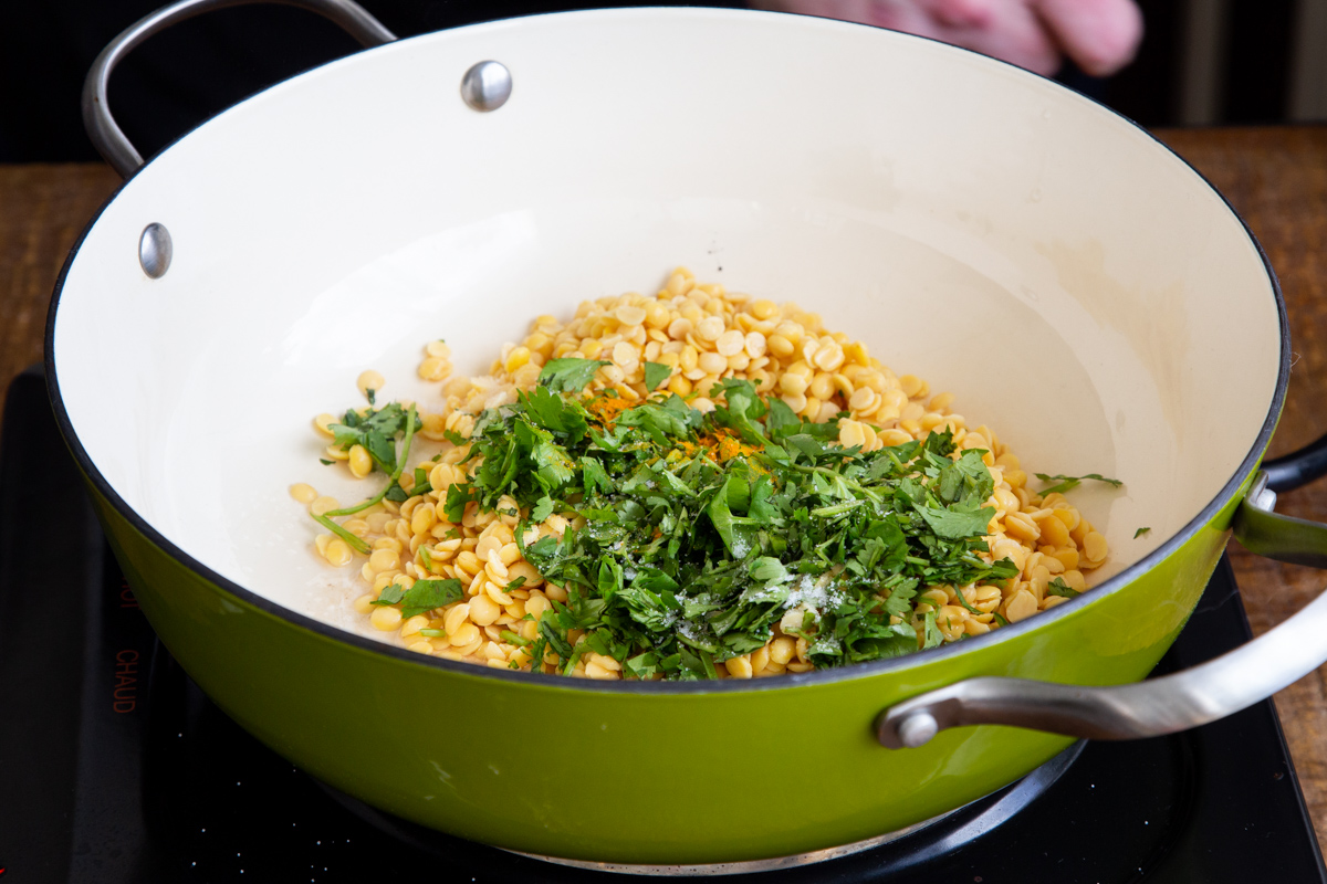 lentils and cilantro in a frying pan
