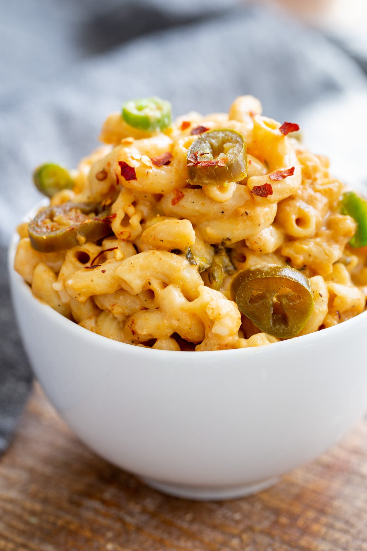 a bowl of jalapeño mac and cheese topped with red pepper flakes