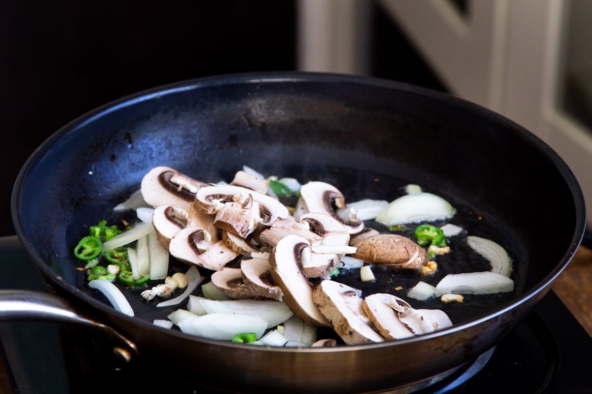 mushrooms, chili and garlic in a black skillet