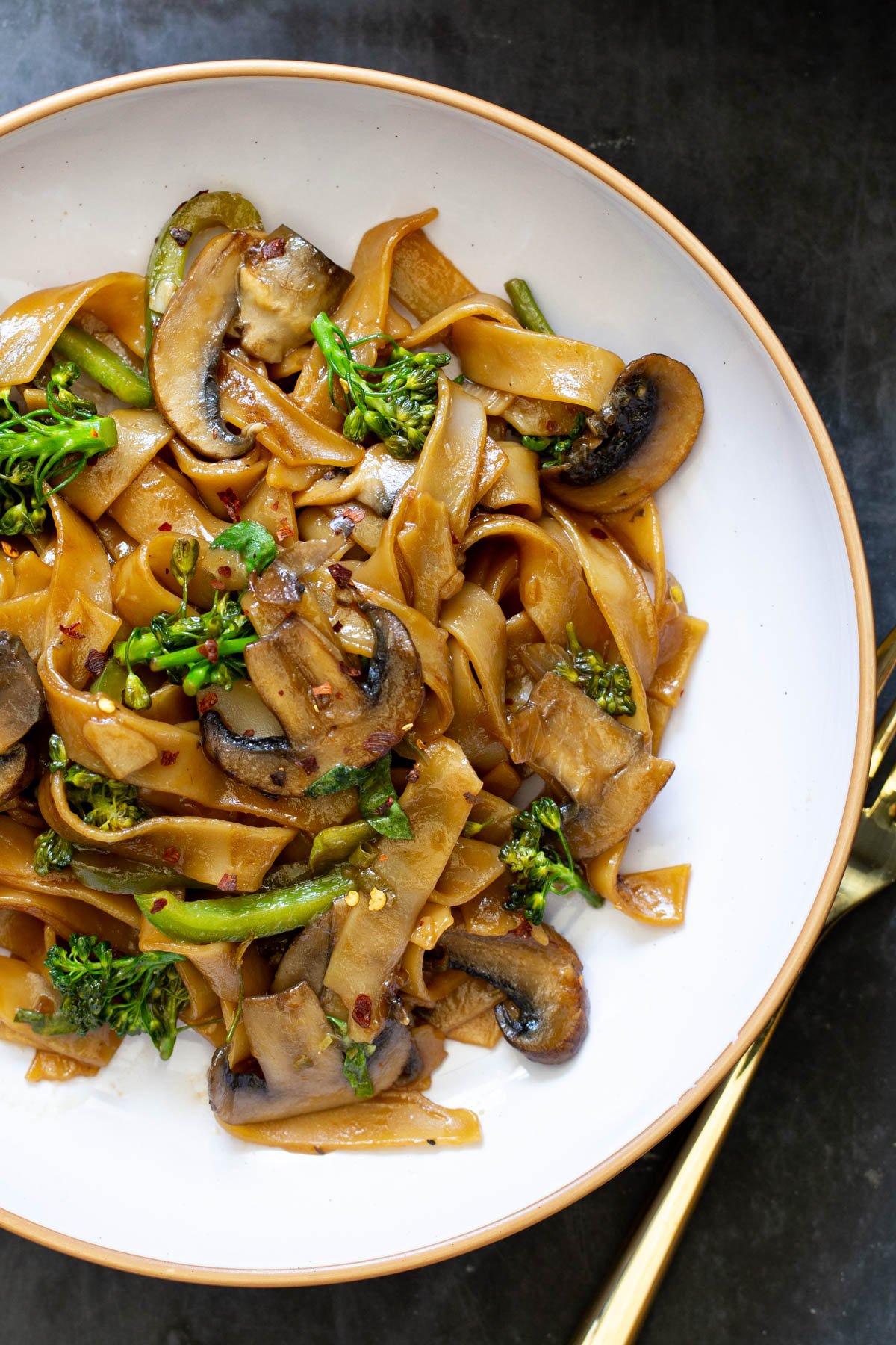 a plate with Thai Skillet Noodles with a golden fork on the side