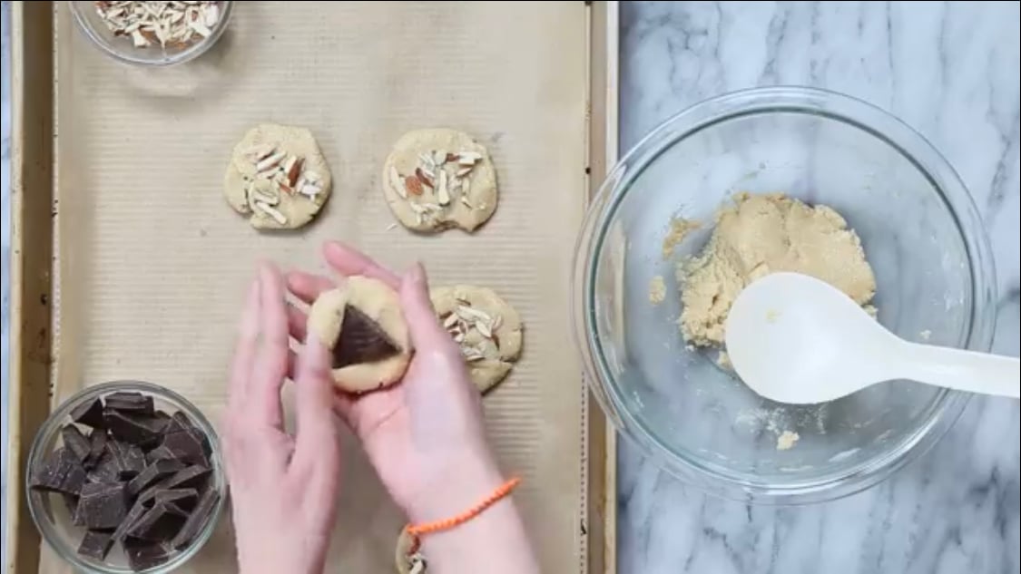 Vegan almond joy cookie dough on parchment lined baking sheet