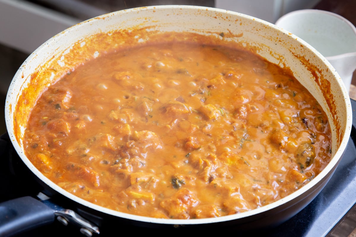 a pan with vegan balti chicken