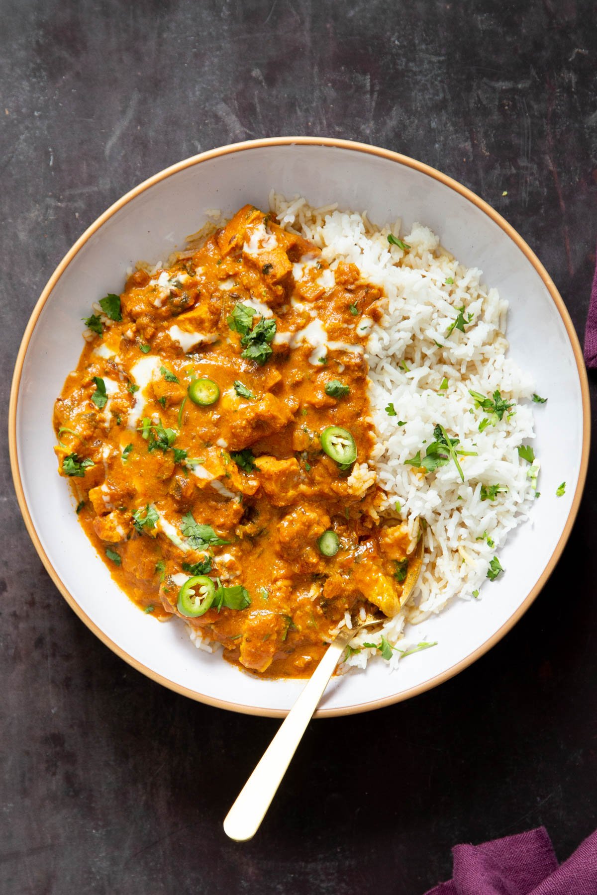 a plate with vegan balti chicken with a side of rice