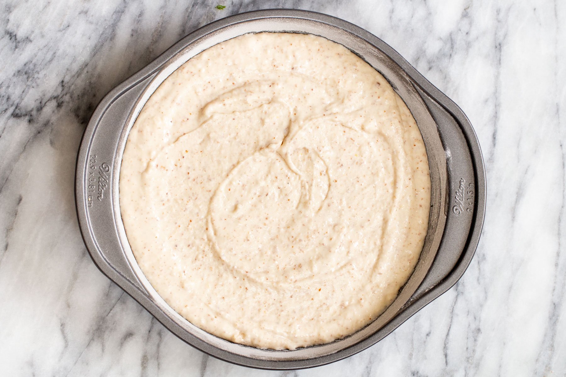 vegan cake batter in a springform pan