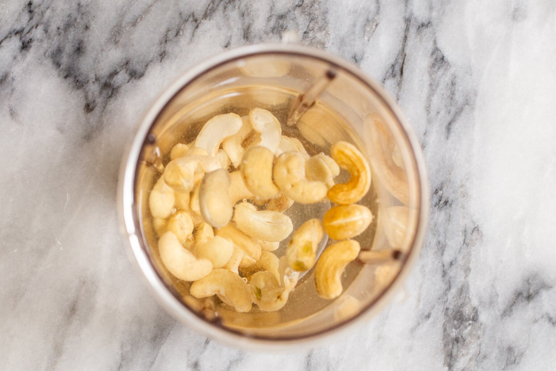 cashews in water in a blender