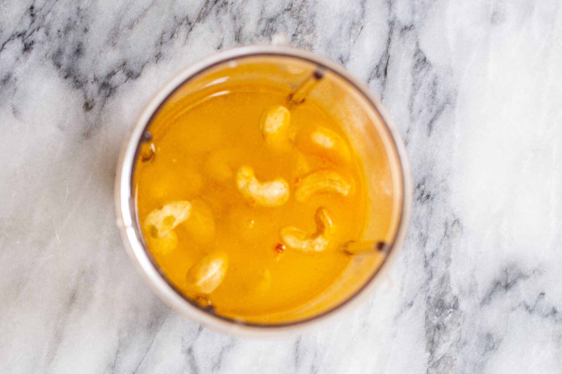 cashews turmeric and water in a blender