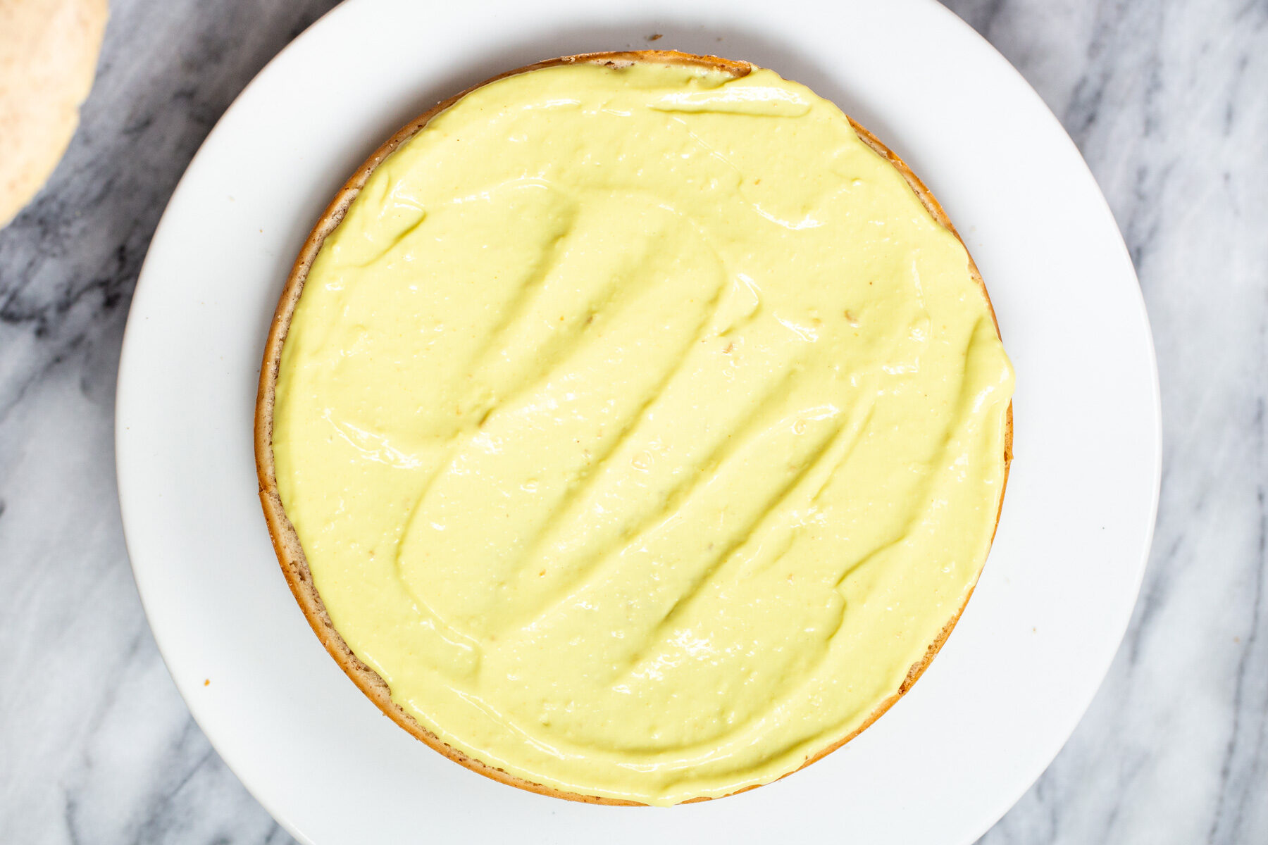 vegan boston cream pie cake being assembled