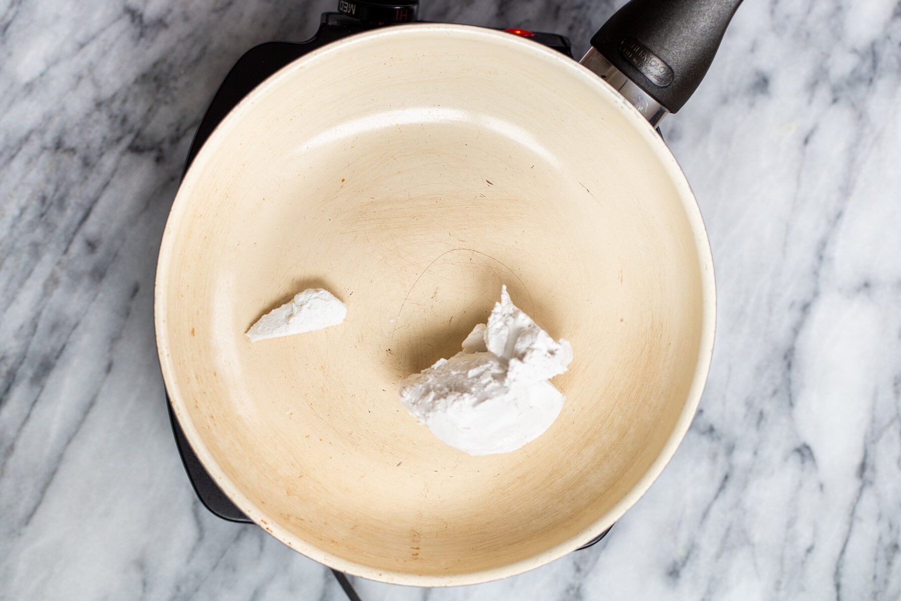 coconut cream in a sauteeing pan