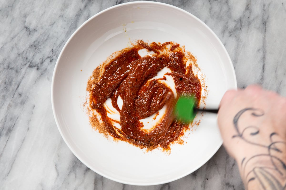 spice paste being mixed in a small bowl