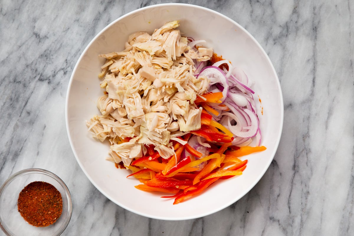 shredded jackfruit, bell pepper and onion in white bowl